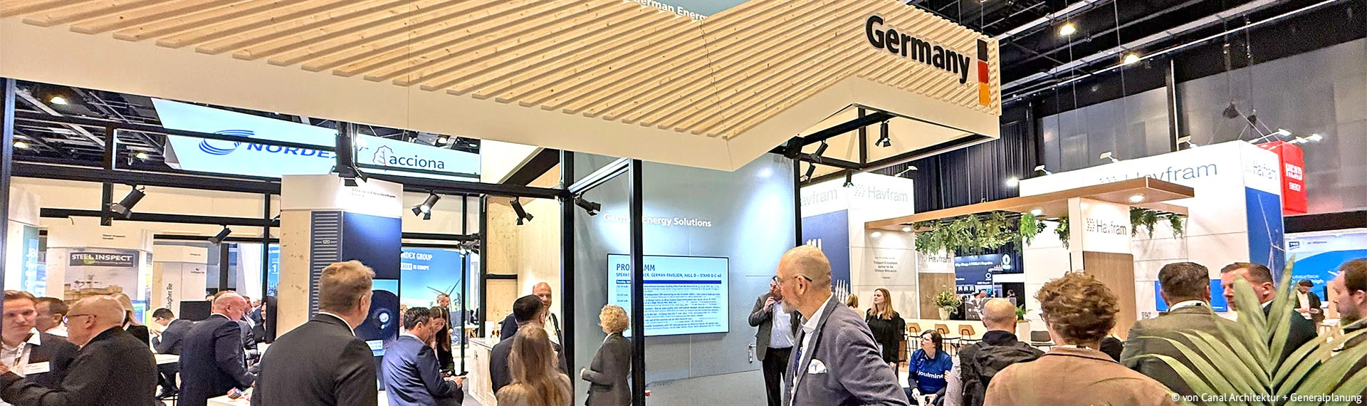 German companies at trade fairs worldwide Visitors enter the German Pavilion inside a trade fair hall.
